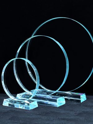 A series of three circular glass awards with rectangle bases from Awards By Hammond
